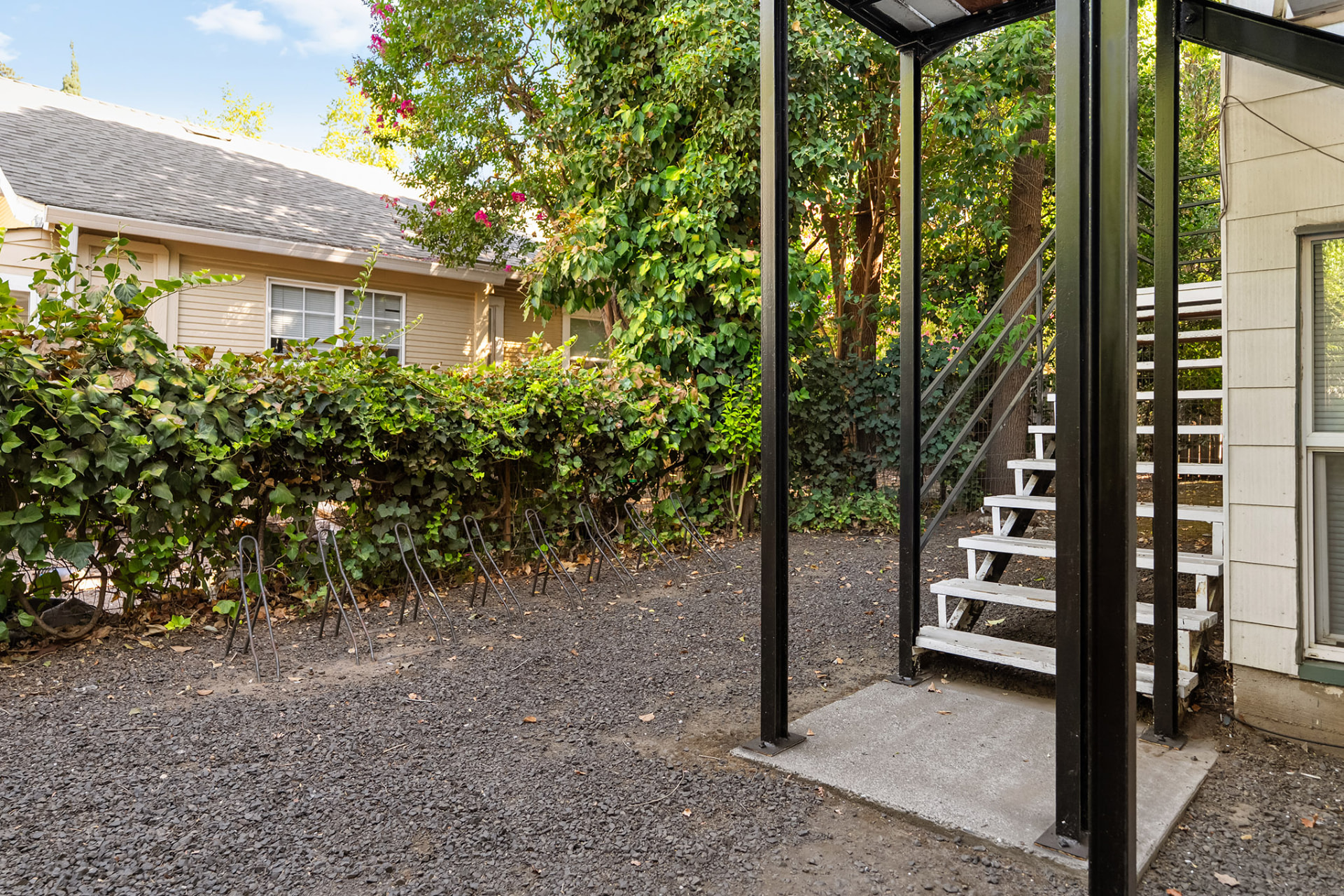 Covered bike parking and exterior stairway between the Magnolia Avenue buildings